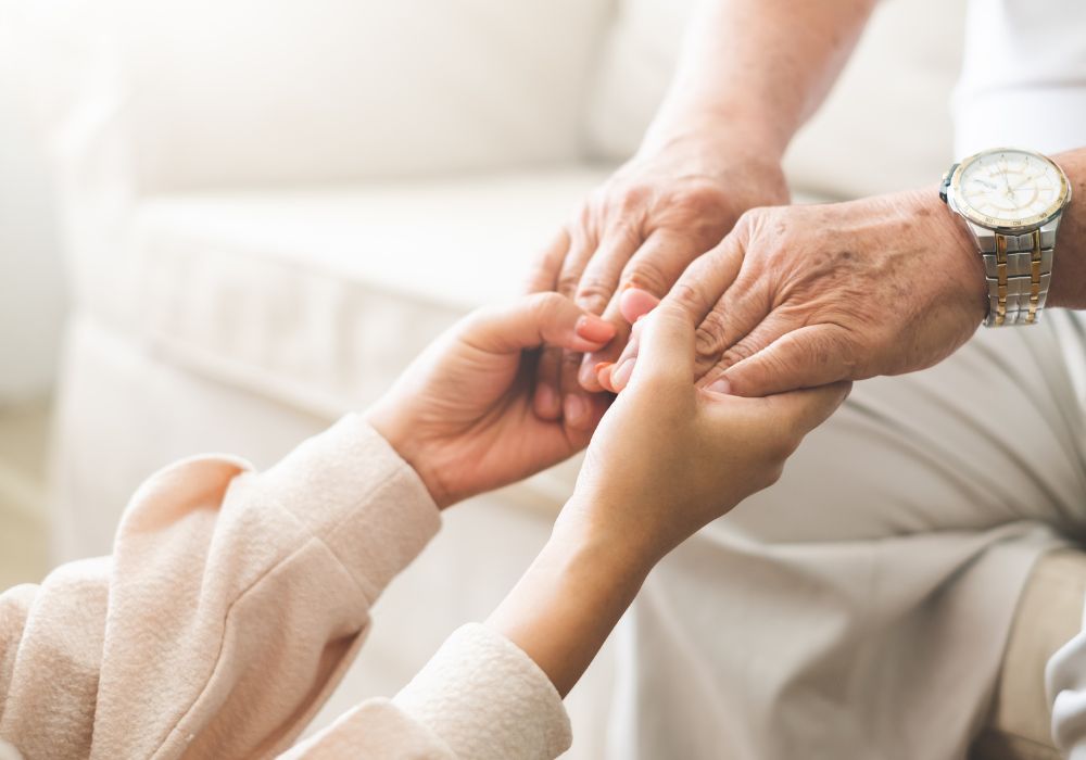 img of two people holding hands