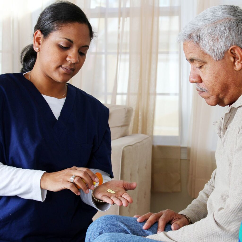 An in-home care nurse distributes medication to a client