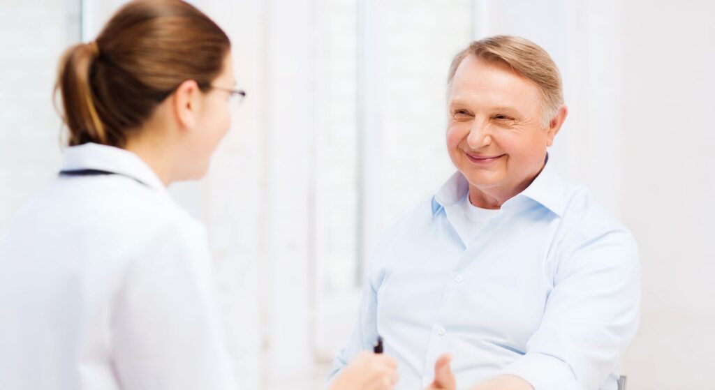 older man meeting with doctor